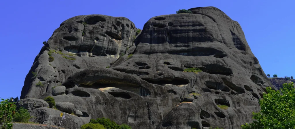 VIEW OF SKETE OF DOUPIANI HIDDEN IN METEORA GREENERY